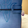 Close up of Blue Goddess Crystal Journal with vegan leather cover and natural crystal closure