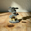 Pyrite crystals that mimic the vibrant foliage of a bonsai tree, symbolizing prosperity and abundance