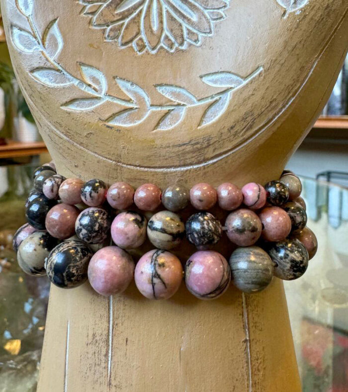 Discover the energy of Rhodonite Crystal Bracelets, crafted for emotional healing and self-love