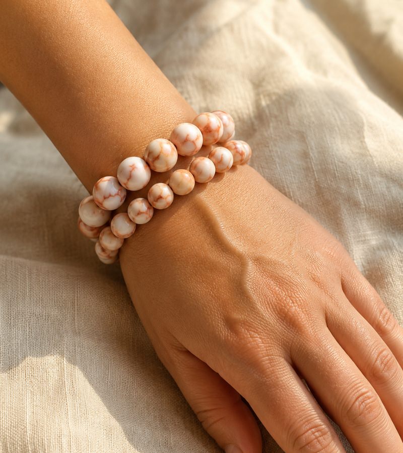 Two Red Vein Jasper Bracelets on wrist
