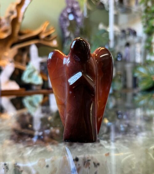 Our Carnelian Crystal Angel serves as a powerful ally, helping you overcome obstacles and pursue your goals with enthusiasm and determination.