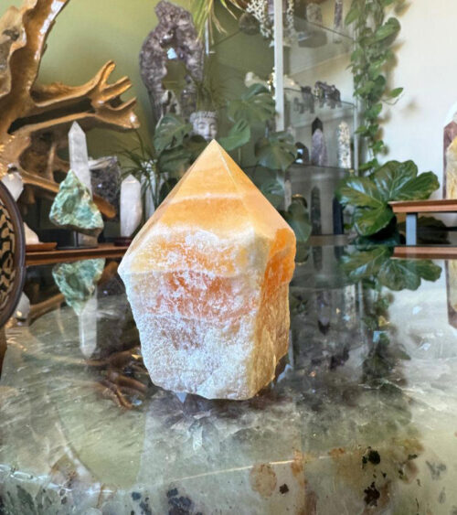 The energy of a Raw Base Orange Calcite Point is warm, uplifting, and highly energizing, making it a powerful tool for transformation and personal growth.