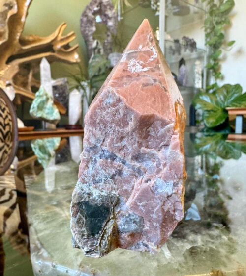 The Raw Base Orange Calcite with Mica Point is both uplifting and energizing, making it an exceptional tool for those seeking to stimulate creativity,