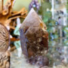 The energy of a Raw Base Smoky Quartz Point is deeply grounding, purifying, and protective