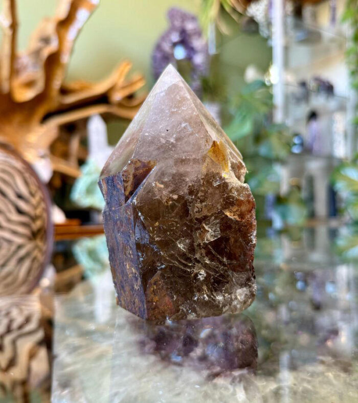 The energy of a Raw Base Smoky Quartz Point is deeply grounding, purifying, and protective