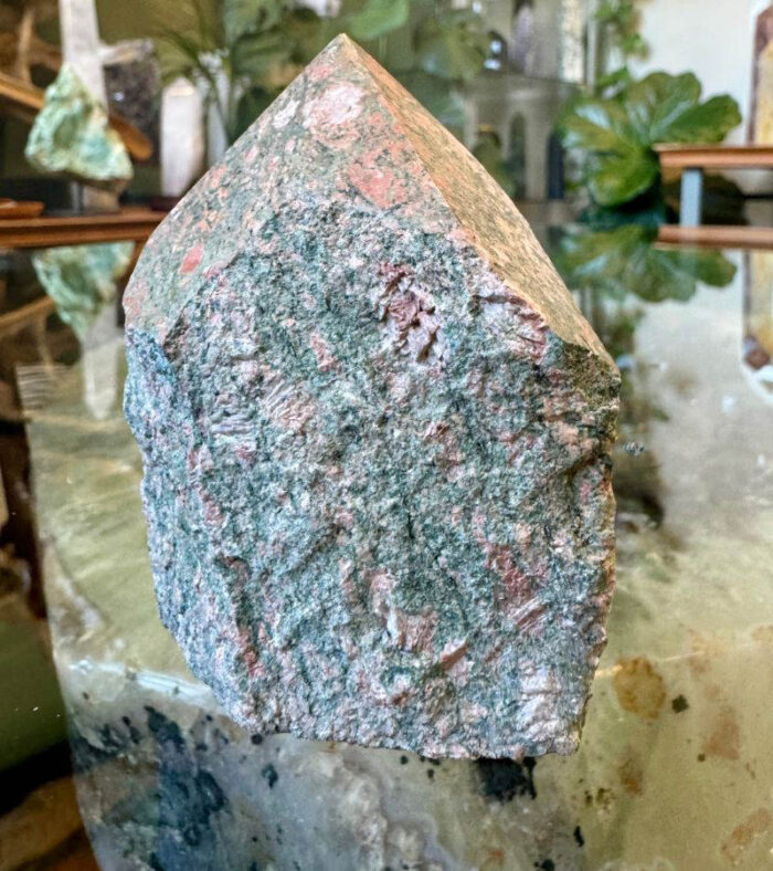 Unakite, known for its beautiful blend of green and pink hues, is a stone that gently supports the heart and mind,