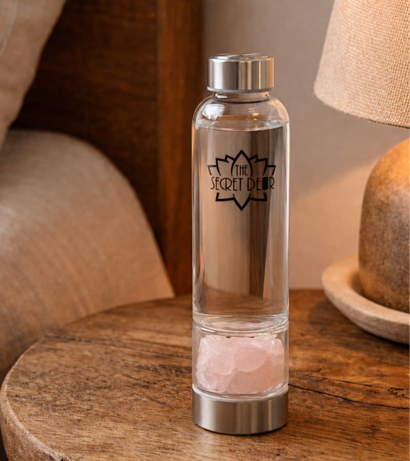 Rose Quartz Crystal Water Bottle on Bedside Table