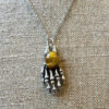 Men's Tiger Eye Skeleton Hand Pendant