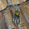 Men's Tiger Eye Skeleton Hand Pendant