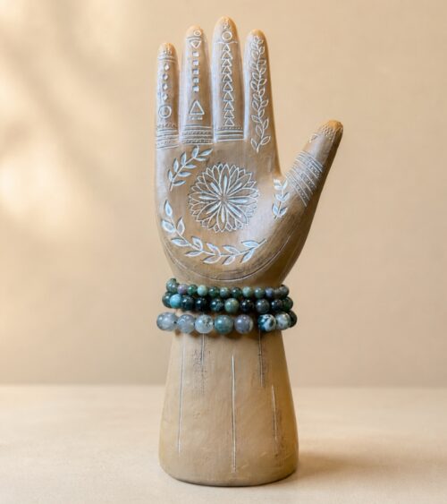 Moss Agate Crystal Bracelets on Wood Hand